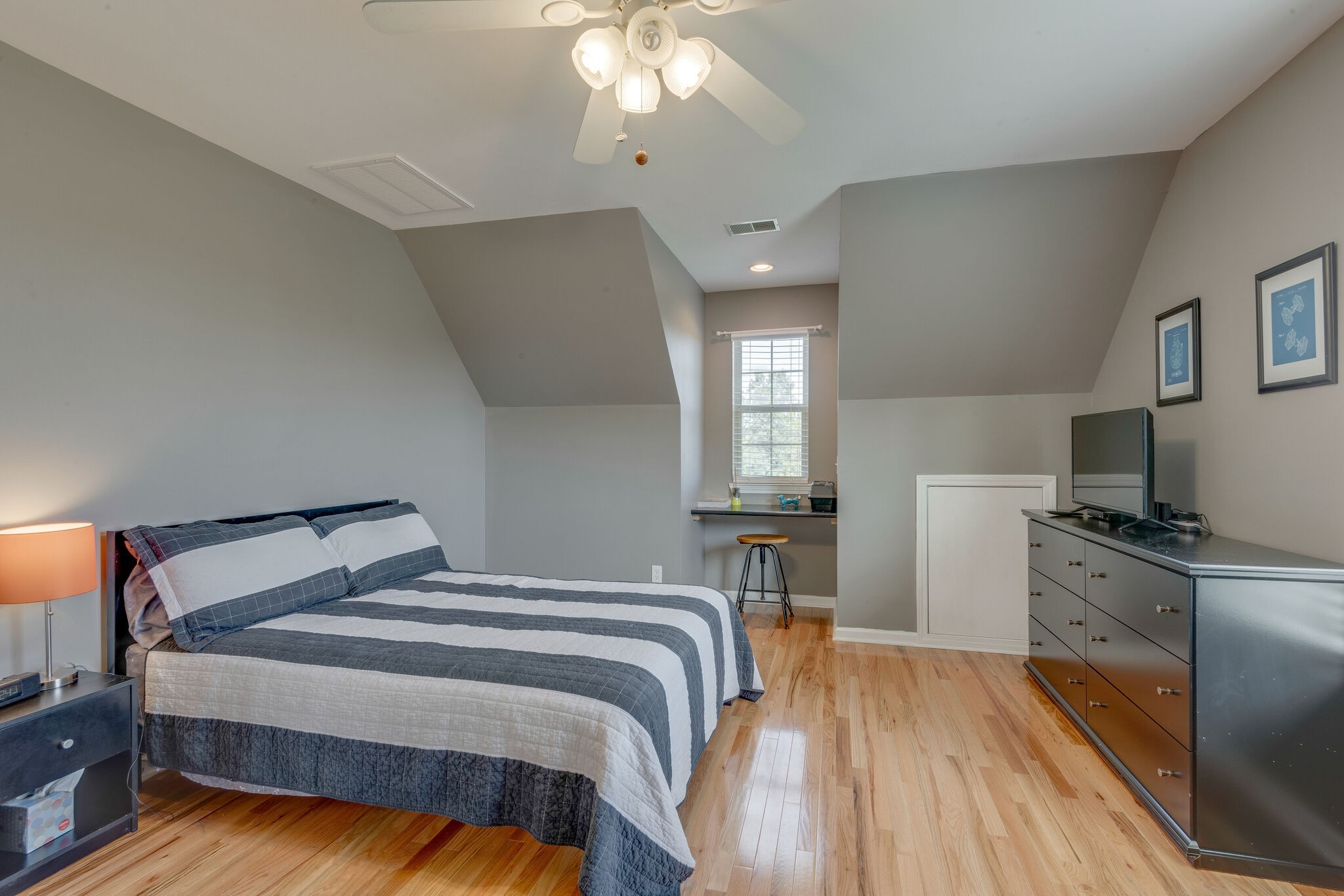 994 Hoover Road Burns, TN 37029 - Photo 22 of 28 a bedroom with a bed and a chandelier