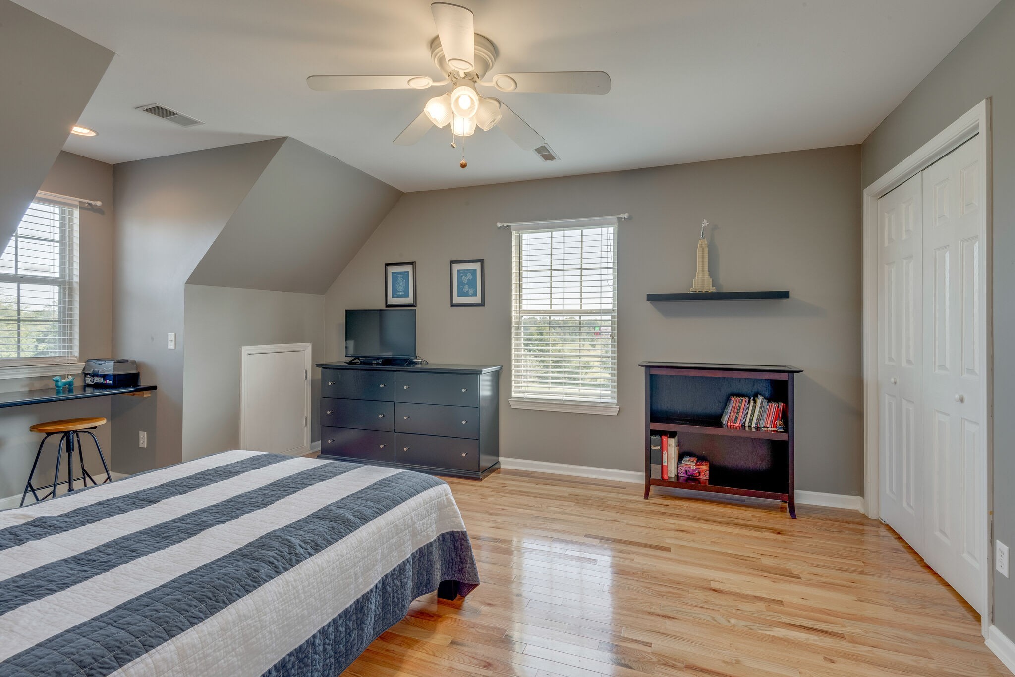 994 Hoover Road Burns, TN 37029 - Photo 23 of 28 a bedroom with a bed and a chandelier