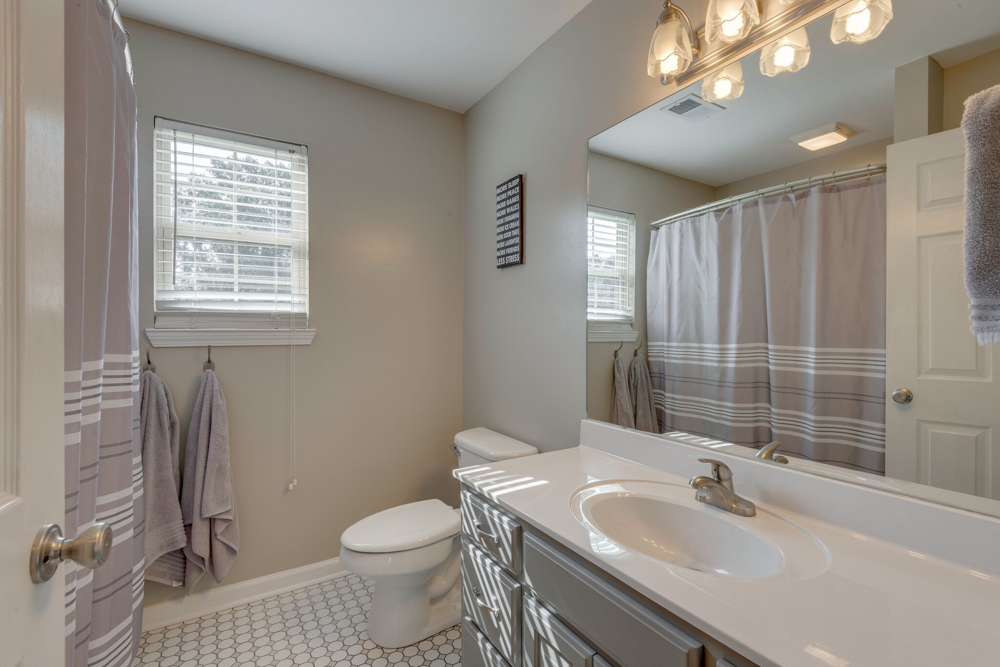 994 Hoover Road Burns, TN 37029 - Photo 24 of 28 a bathroom with a sink toilet and shower