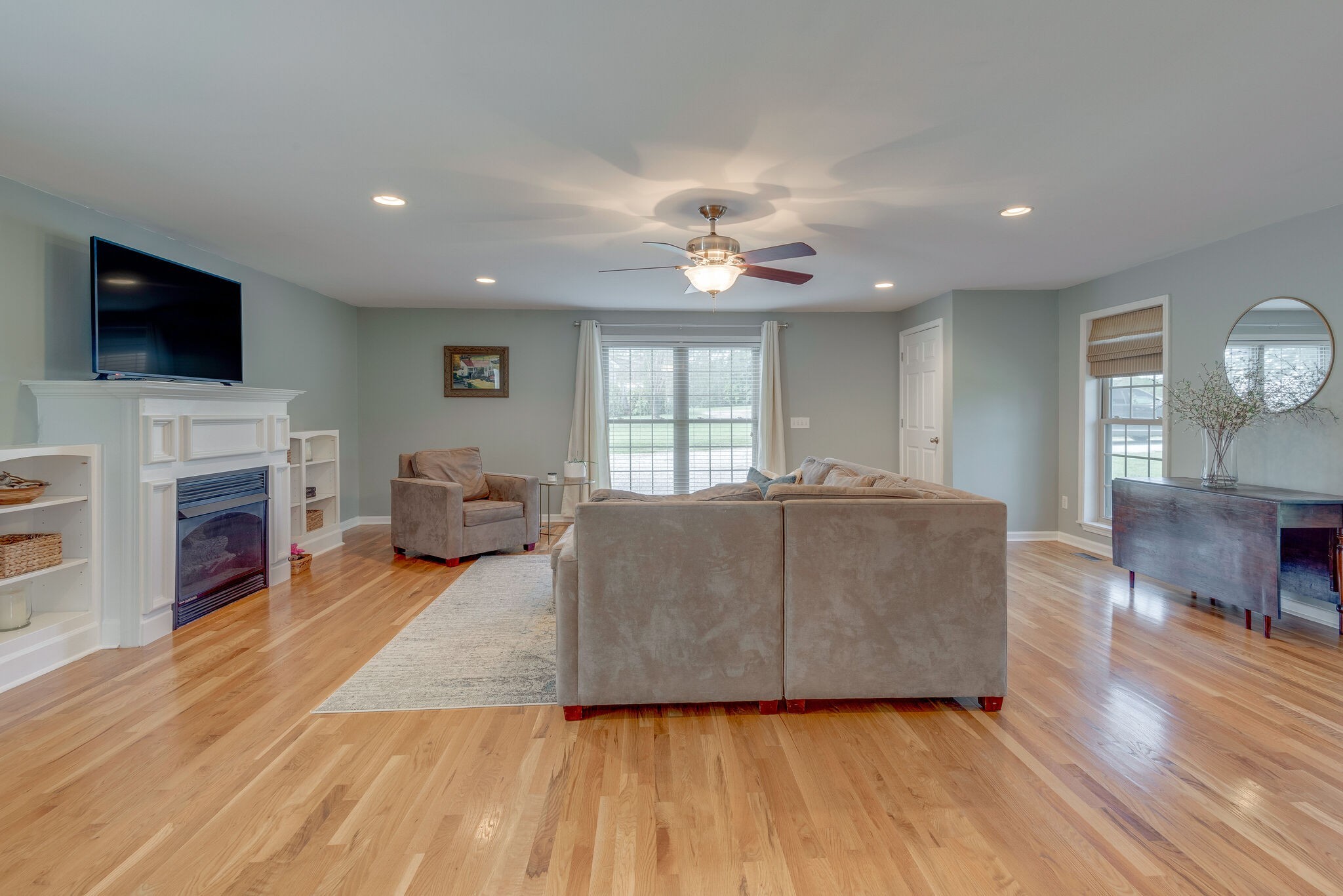 994 Hoover Road Burns, TN 37029 - Photo 5 of 28 a living room with furniture fireplace and flat screen tv