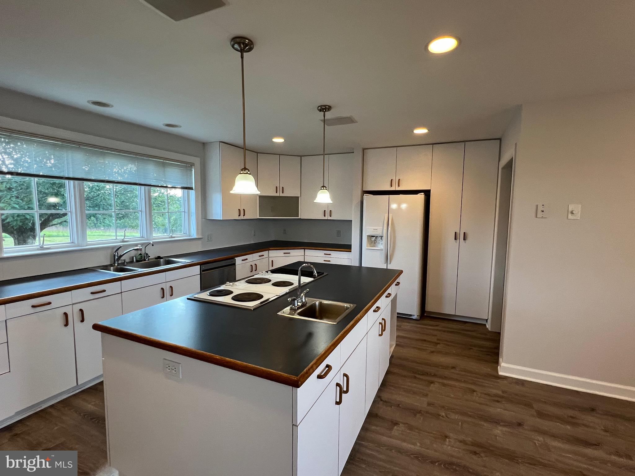 1343 Phoenix Road Sparks Glencoe, MD 21152 - Photo 13 of 57 a kitchen that has a sink stainless steel appliances a counter space and a window