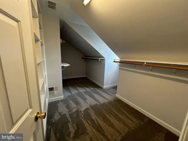 a bathroom with a sink and a window