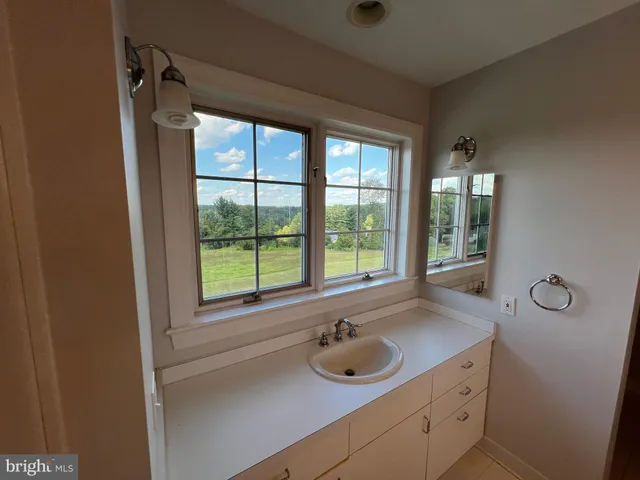a bathroom with a glass shower door