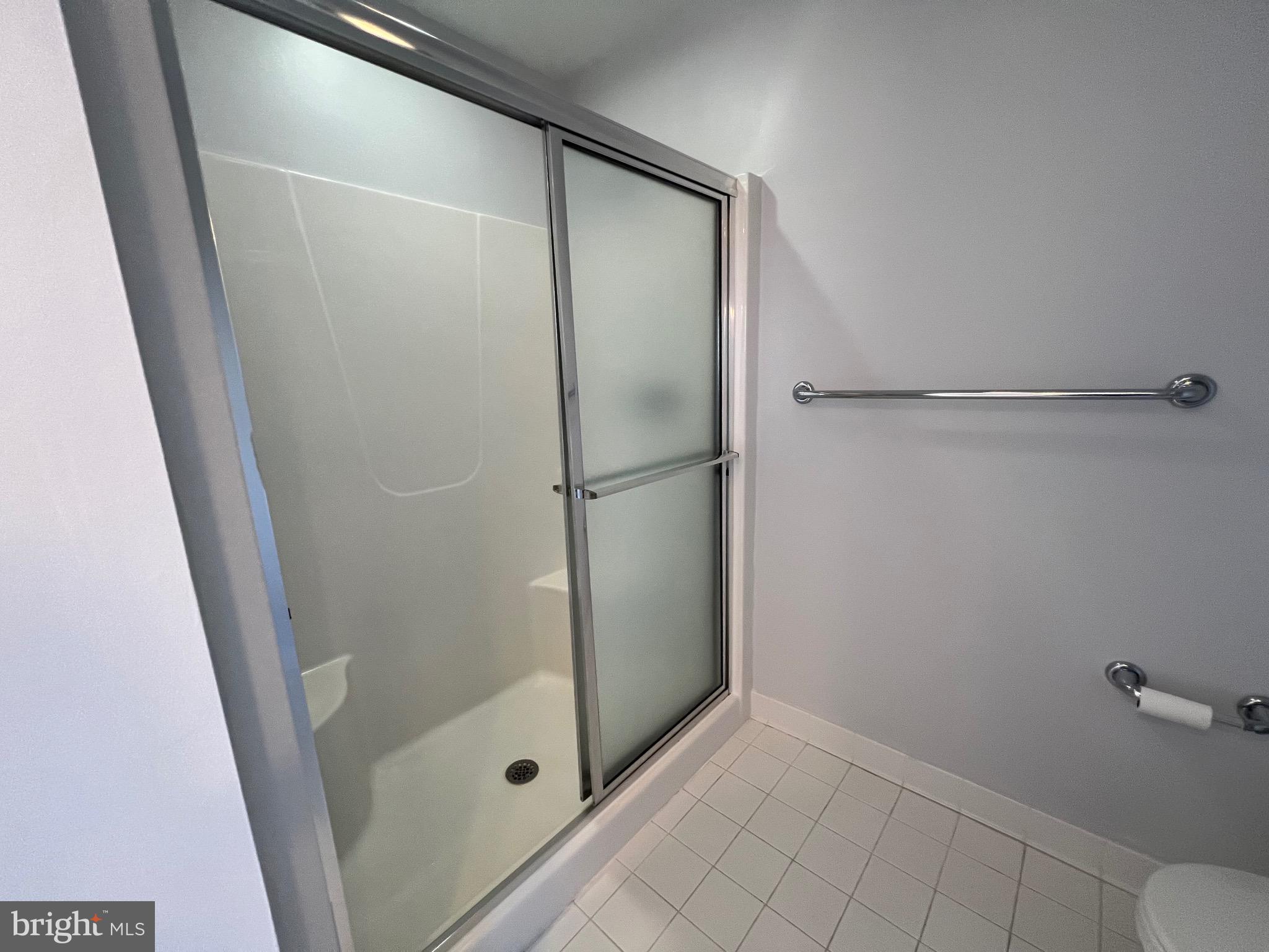 1343 Phoenix Road Sparks Glencoe, MD 21152 - Photo 38 of 57 a bathroom with a glass shower door