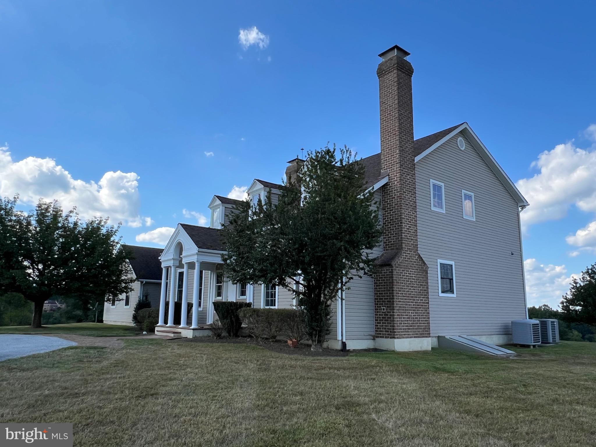 1343 Phoenix Road Sparks Glencoe, MD 21152 - Photo 4 of 57 a front view of a house with a garden and plants