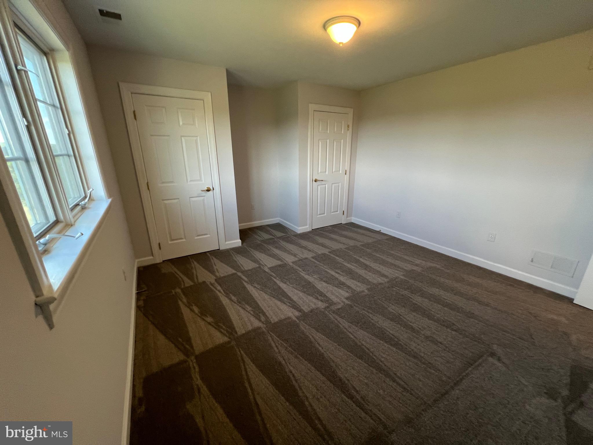 1343 Phoenix Road Sparks Glencoe, MD 21152 - Photo 43 of 57 an empty room with wooden floor and windows