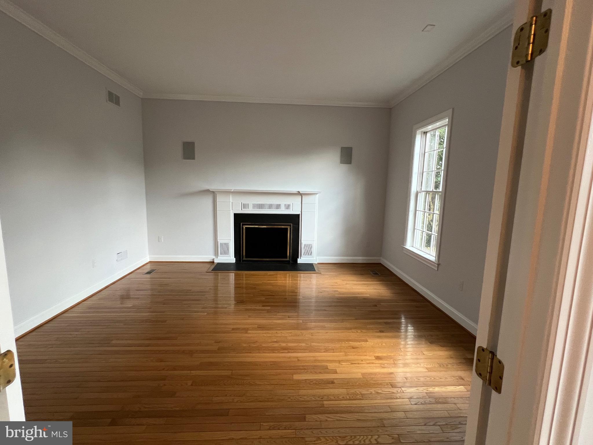 1343 Phoenix Road Sparks Glencoe, MD 21152 - Photo 7 of 57 a view of empty room with wooden floor and fireplace
