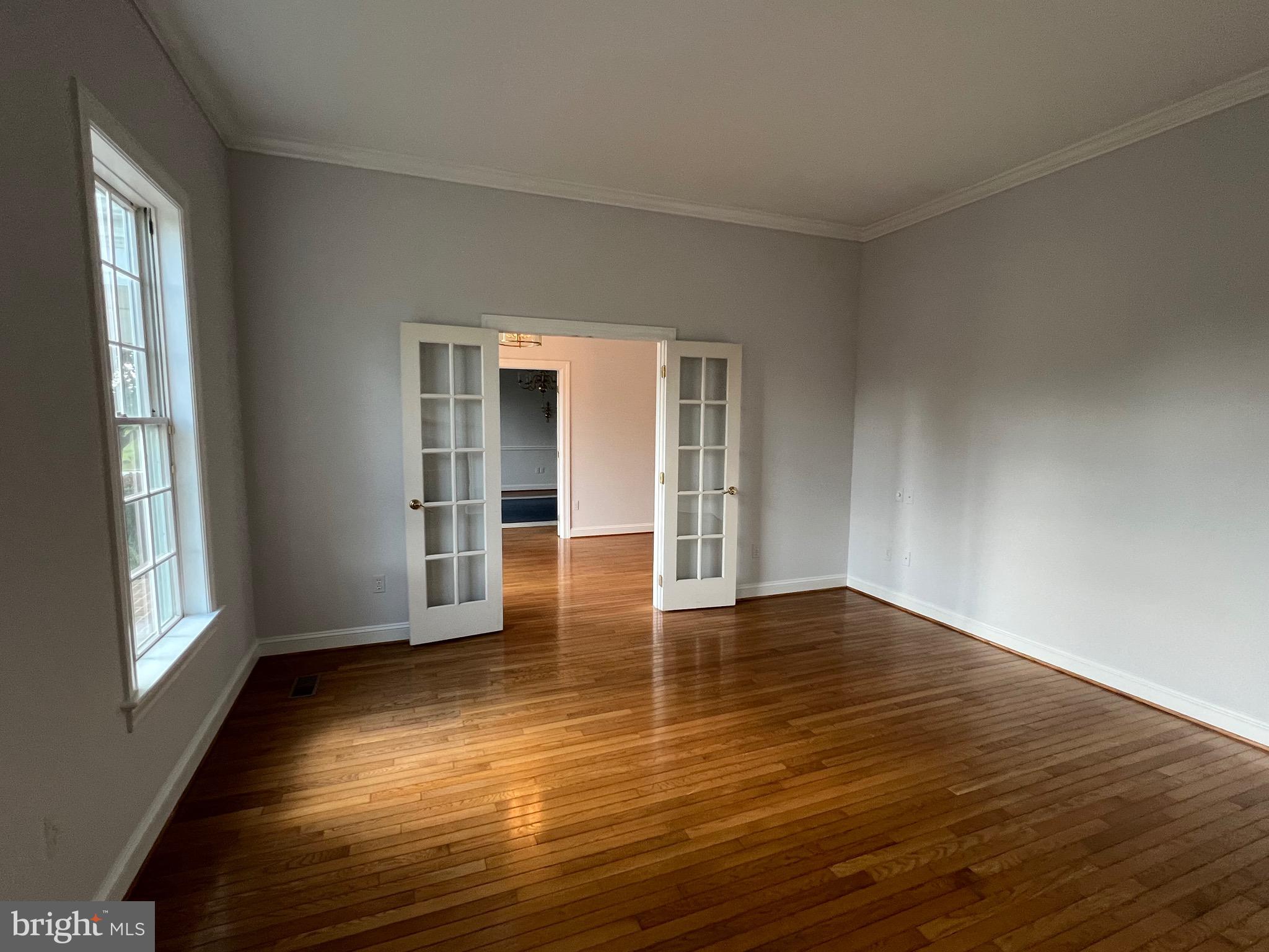 1343 Phoenix Road Sparks Glencoe, MD 21152 - Photo 8 of 57 a view of empty room with wooden floor and fan