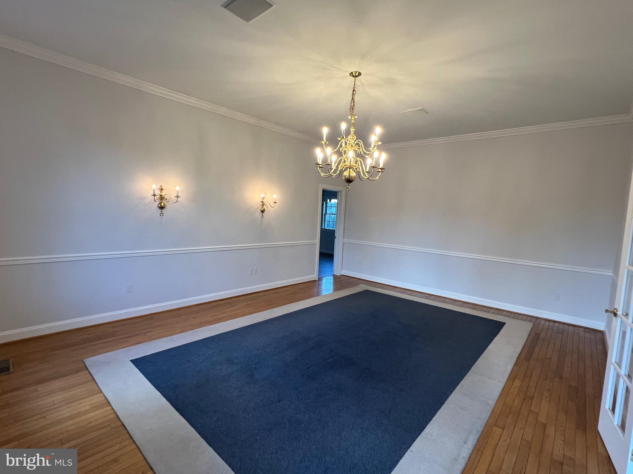 1343 Phoenix Road Sparks Glencoe, MD 21152 - Photo 9 of 57 a view of a room with wooden floor and chandelier