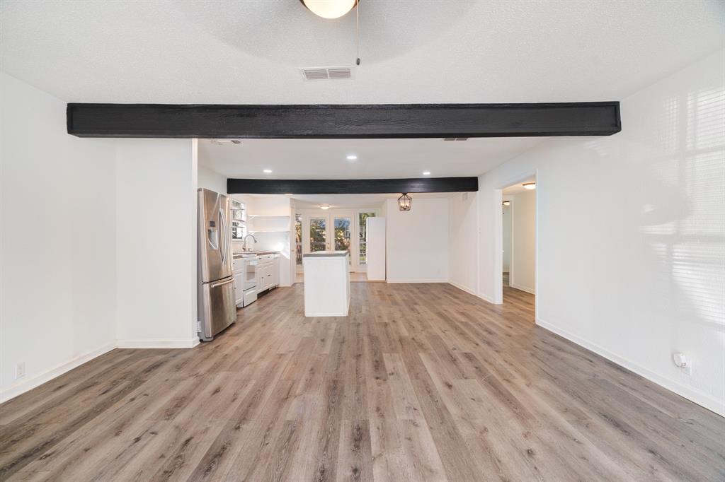 2413 Simpson Street Paris, TX 75460 - Photo 2 of 15 a view of a hallway with wooden floor