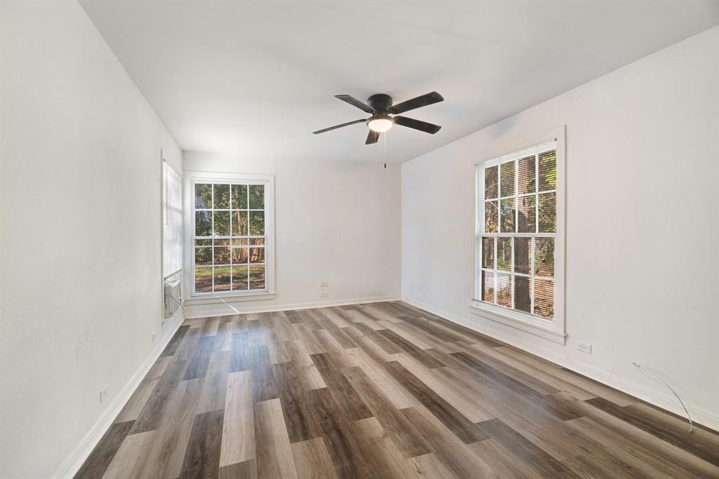 2413 Simpson Street Paris, TX 75460 - Photo 6 of 15 a view of empty room with wooden floor and fan