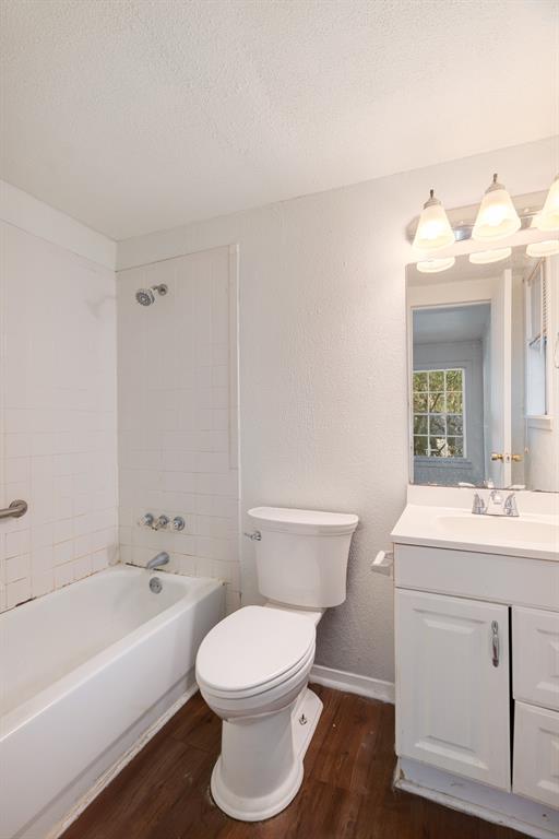 2413 Simpson Street Paris, TX 75460 - Photo 7 of 15 a bathroom with a sink a toilet and bathtub