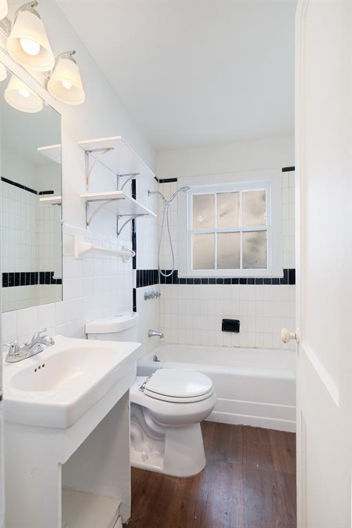 2413 Simpson Street Paris, TX 75460 - Photo 9 of 15 a bathroom with a sink a toilet and shower