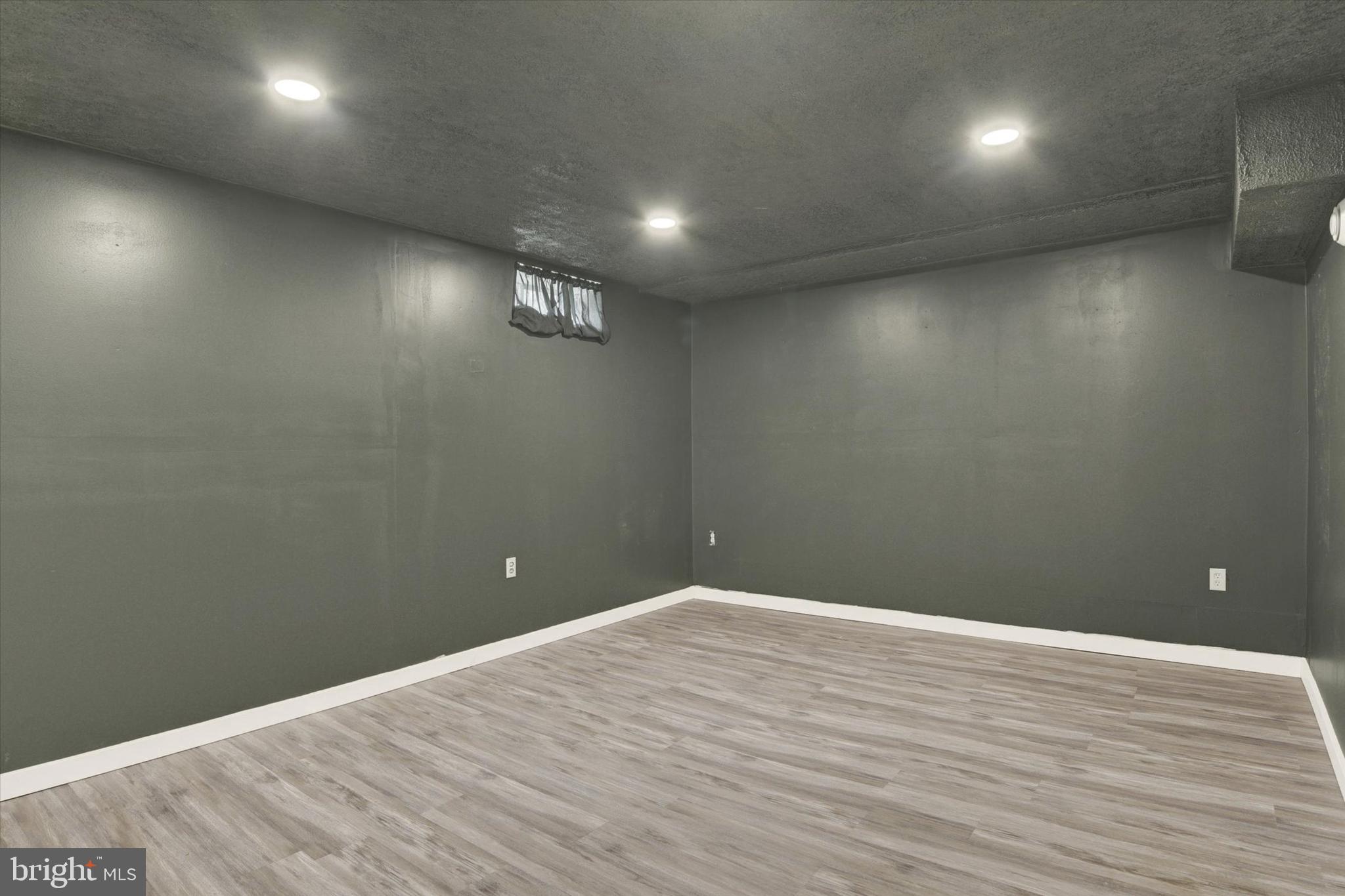 48 Dustin Drive Halifax, PA 17032 - Photo 26 of 31 an empty room with wooden floor and windows