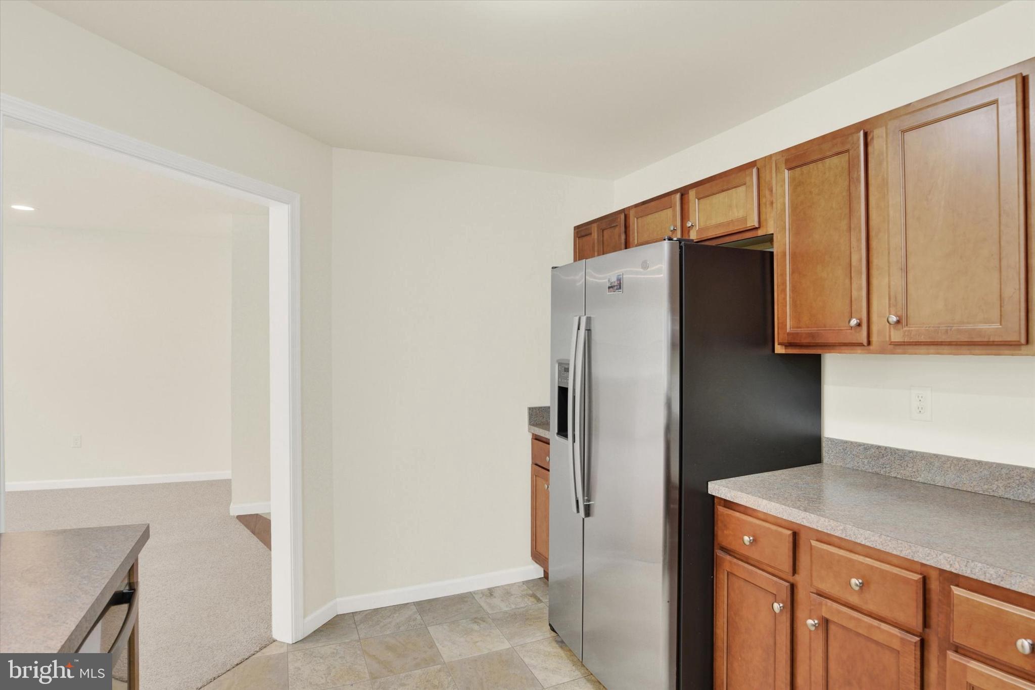 48 Dustin Drive Halifax, PA 17032 - Photo 9 of 31 a kitchen with stainless steel appliances a refrigerator and cabinets