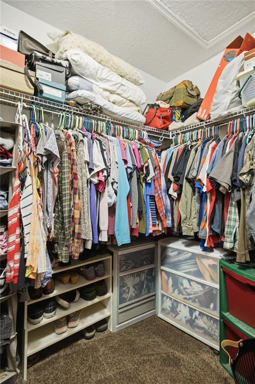 17900 Northwest 120th Avenue Road Reddick, FL 32686 - Photo 33 of 45 a view of walk in closet with clothes