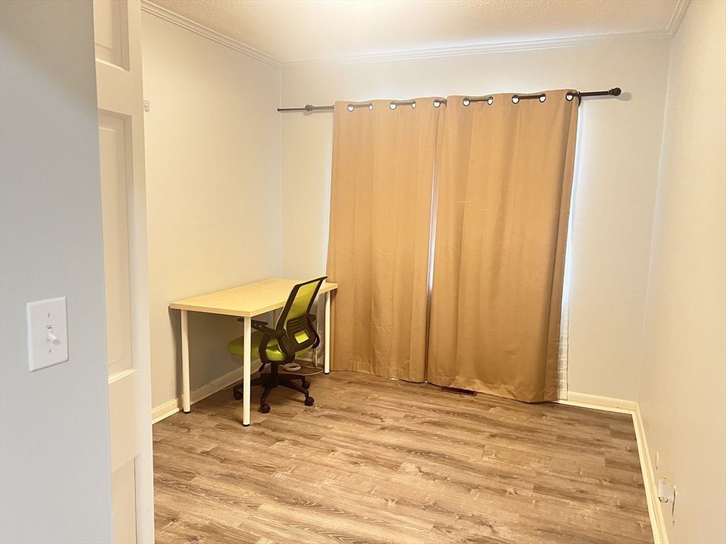 11 Lake Shore Court, Unit 2 Boston, MA 02135 - Photo 5 of 9 a view of a room with a table and chair