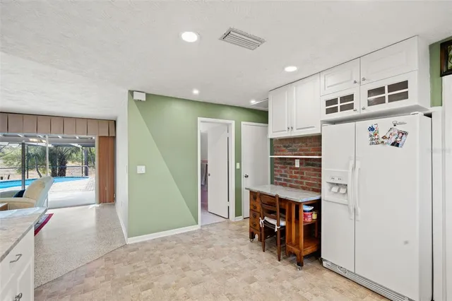 a view of a livingroom with furniture and an entryway