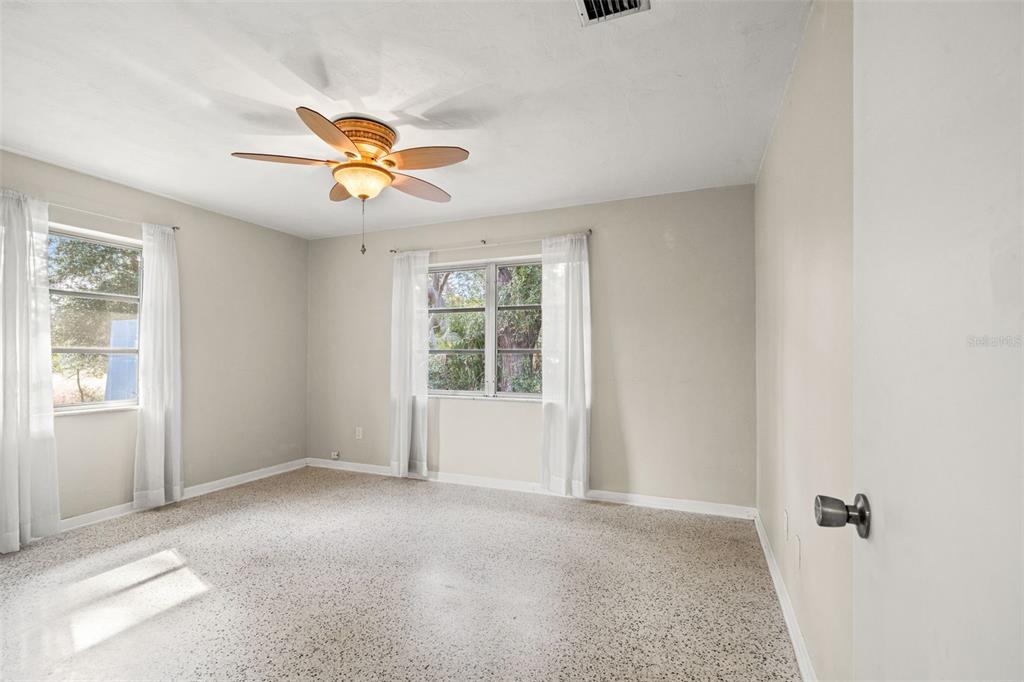 6422 Fairlawn Street Spring Hill, FL 34606 - Photo 13 of 43 a view of a livingroom with a ceiling fan and window