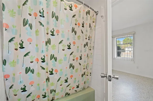a bathroom with a shower curtain