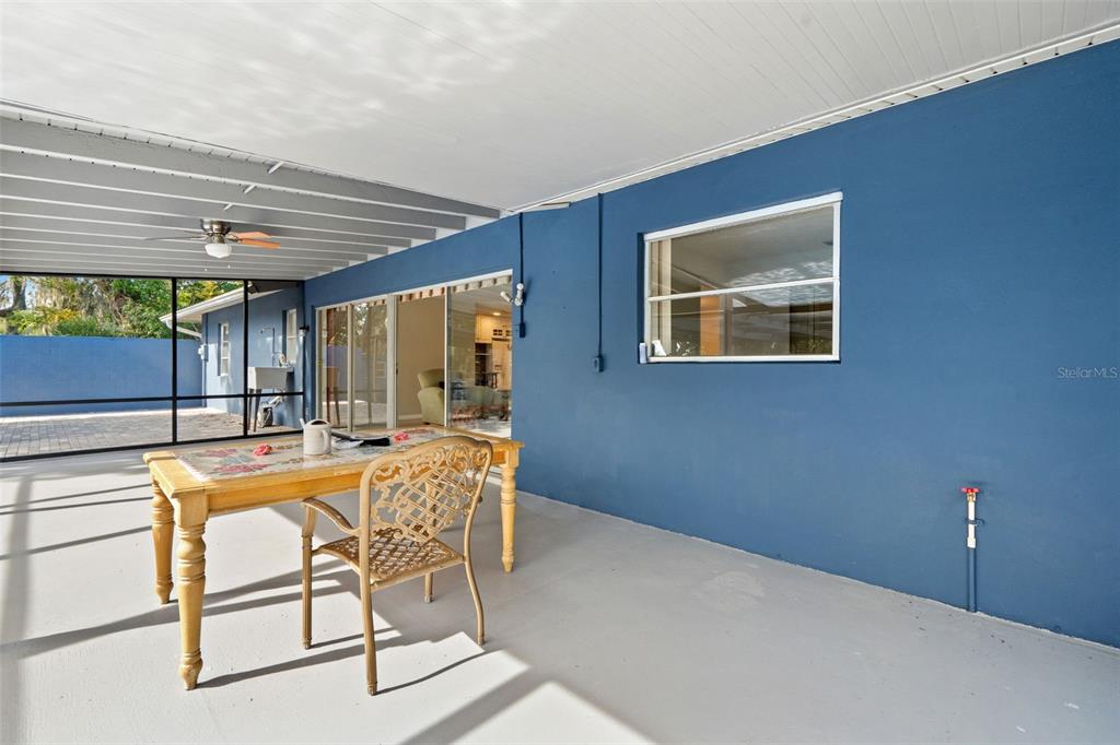 6422 Fairlawn Street Spring Hill, FL 34606 - Photo 34 of 43 a dining room with furniture and a large window
