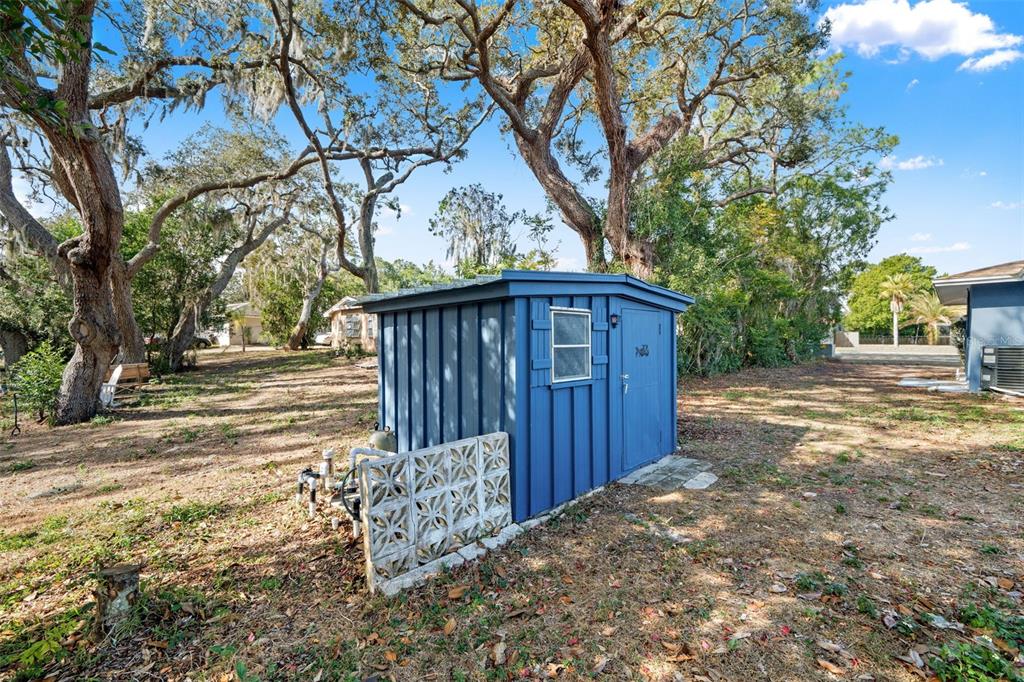 6422 Fairlawn Street Spring Hill, FL 34606 - Photo 36 of 43 a view of a wooden fence next to a road