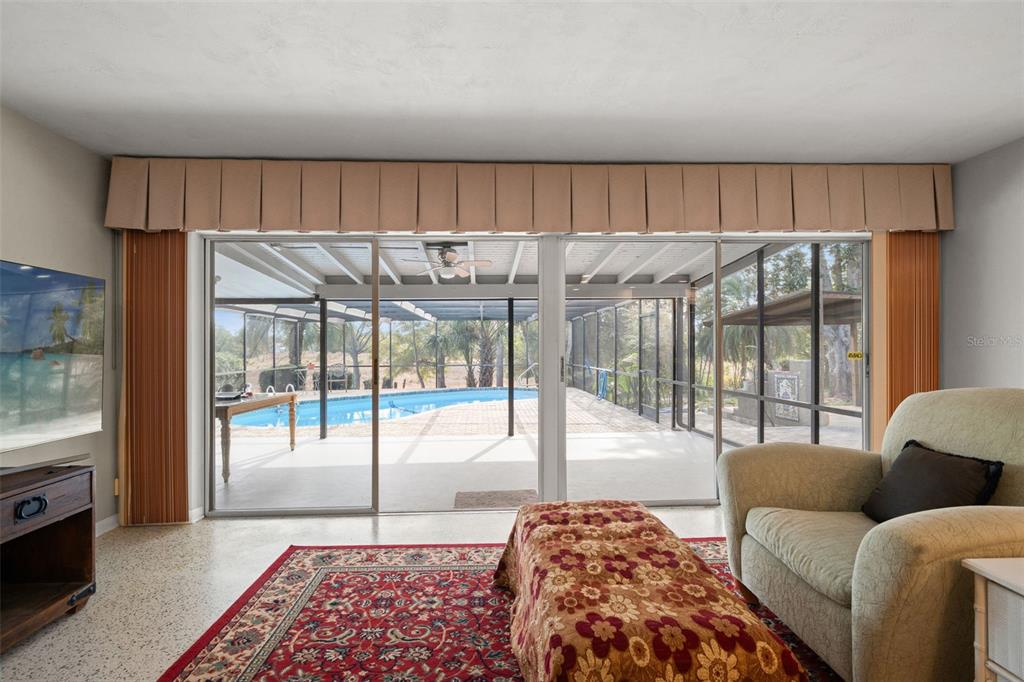 6422 Fairlawn Street Spring Hill, FL 34606 - Photo 6 of 43 a bedroom with furniture and a large window