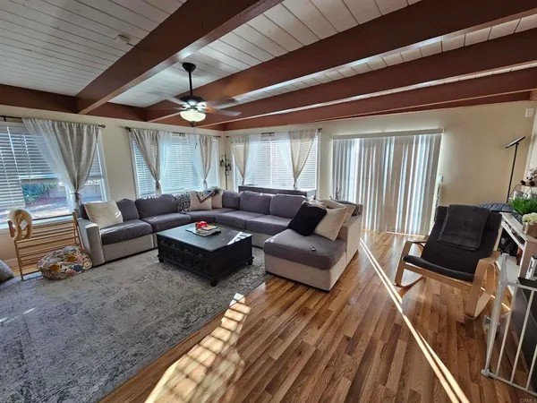 a living room with furniture and a large window
