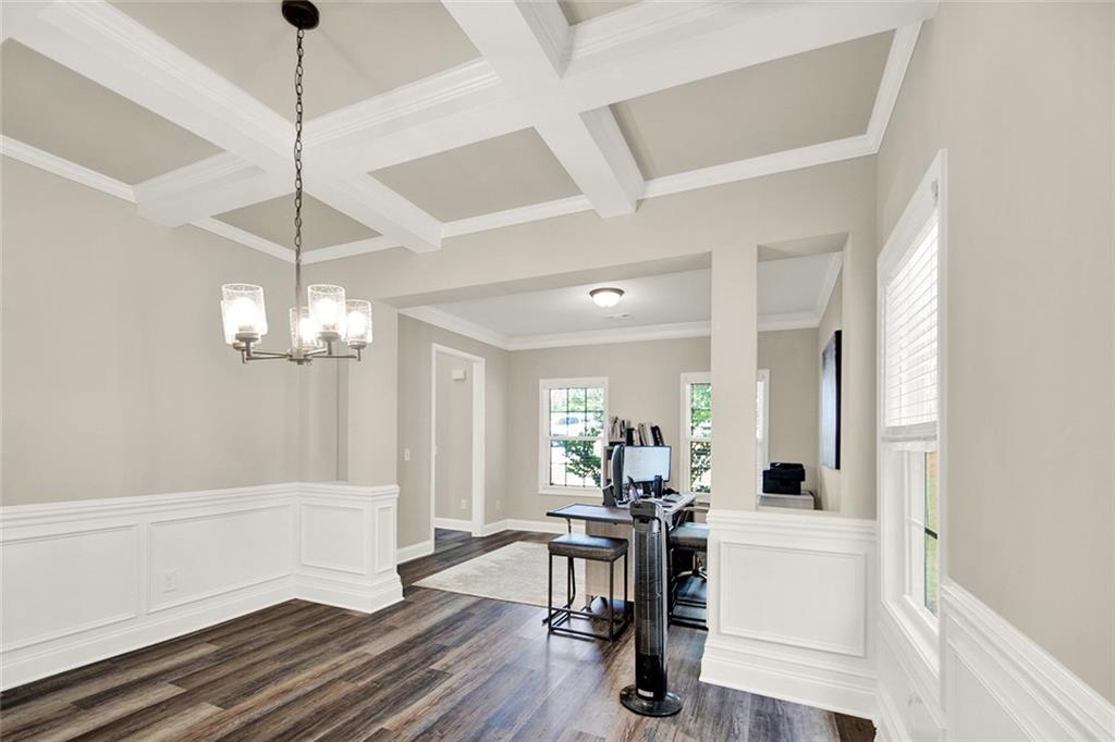 407 Corinth Church Road Winder, GA 30680 - Photo 17 of 66 a view of a dining room with furniture wooden floor and chandelier