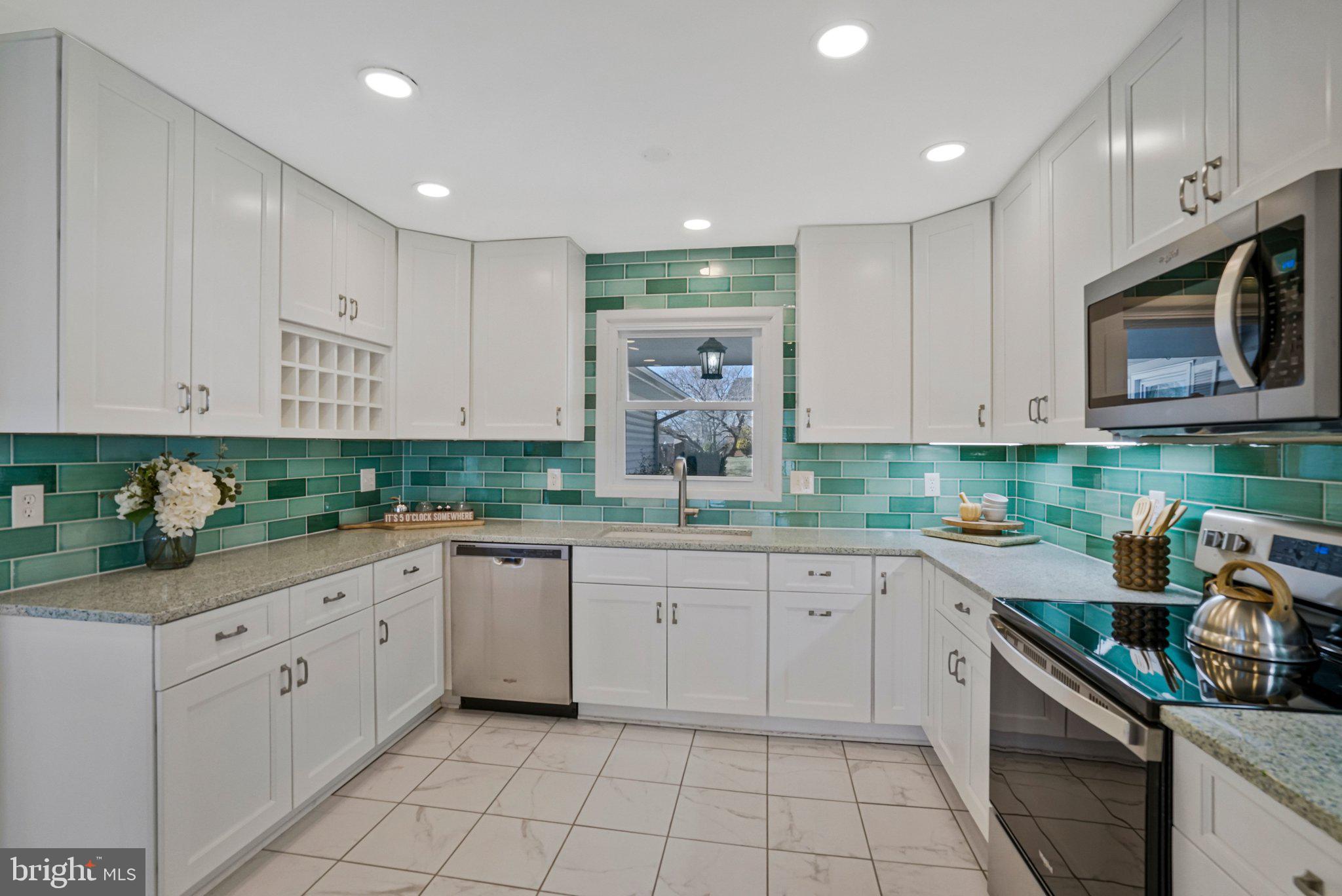 4103 Port Rae Lane Fairfax, VA 22033 - Photo 6 of 47 Kitchen with white cabinets and SS appliances