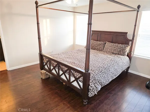 a view of a balcony with wooden floor