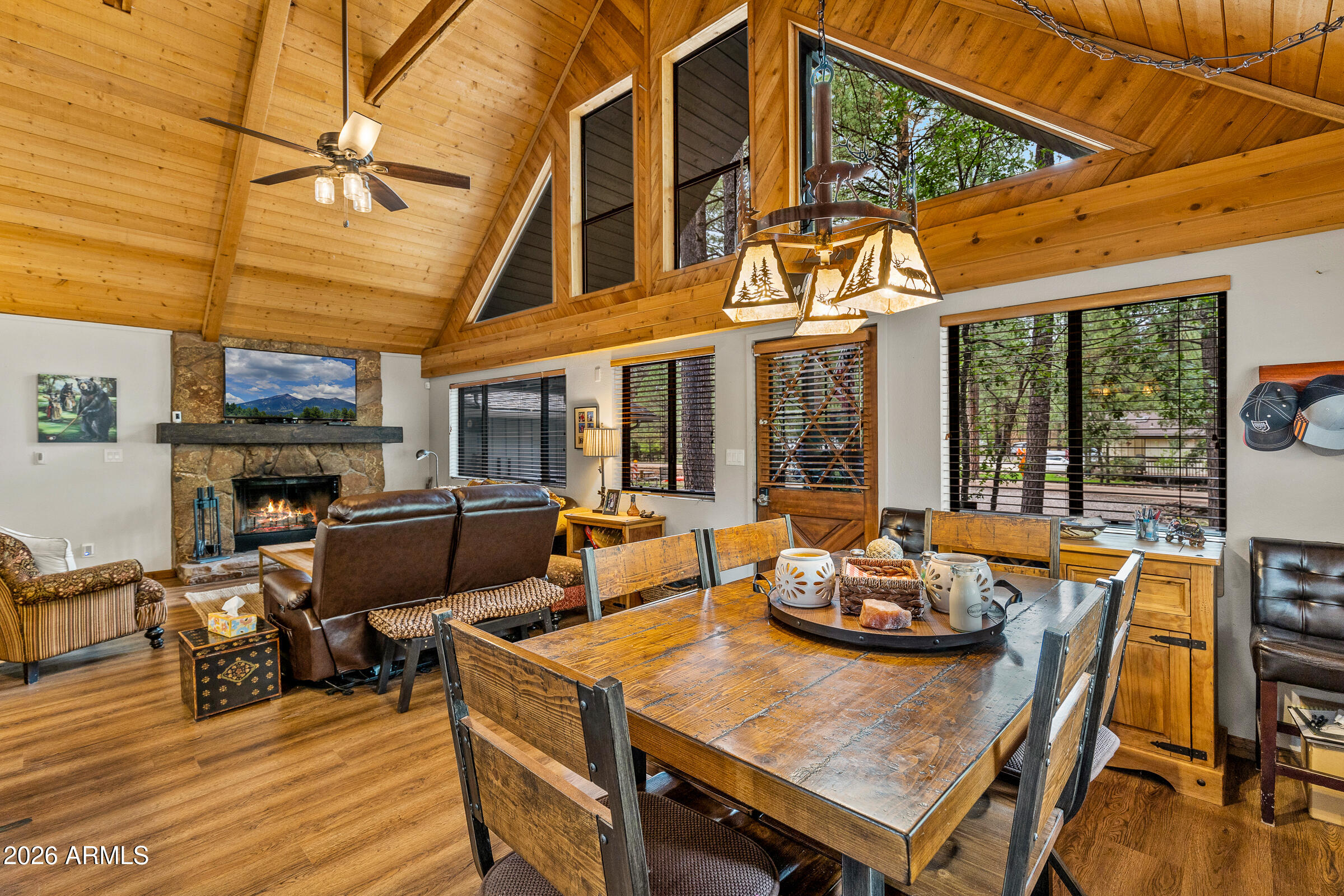 755 East Meadow View Road Munds Park, AZ 86017 - Photo 12 of 35 a view of a patio with table and chairs
