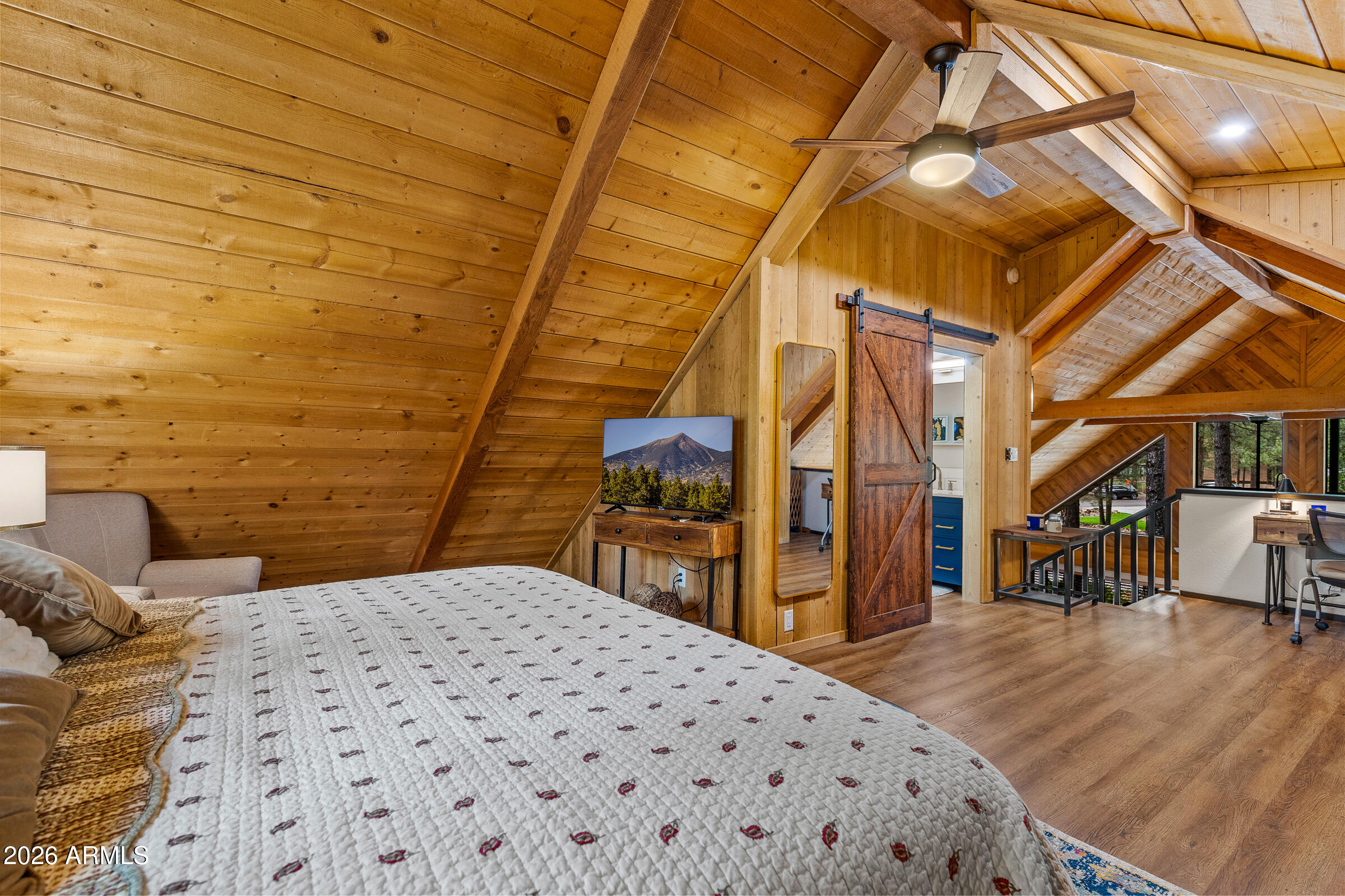 755 East Meadow View Road Munds Park, AZ 86017 - Photo 21 of 35 a bedroom with a bed and a table