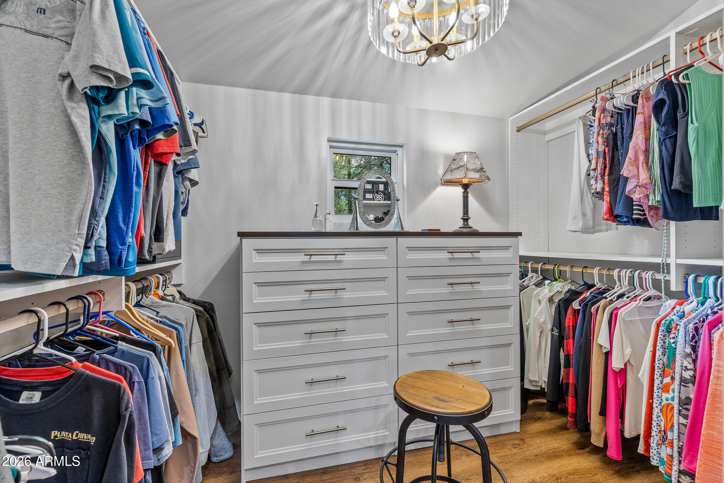 755 East Meadow View Road Munds Park, AZ 86017 - Photo 29 of 35 a view of walk in closet with clothes and shoes
