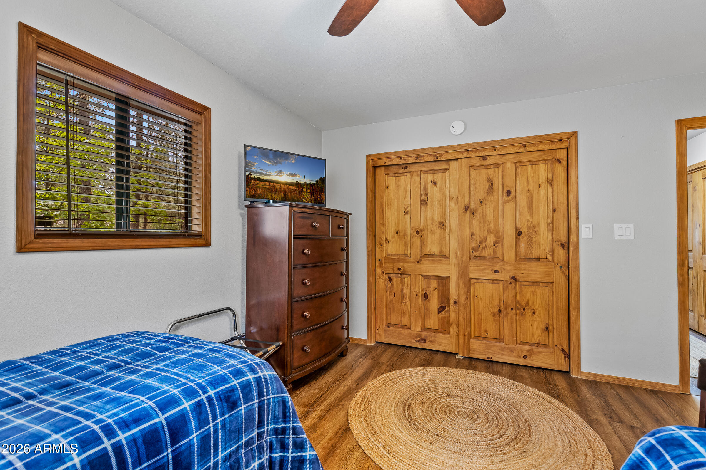 755 East Meadow View Road Munds Park, AZ 86017 - Photo 33 of 35 a bedroom with a bed and teddy bear on bed