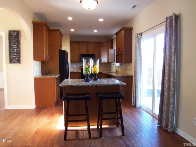 a kitchen with a table and chairs in it