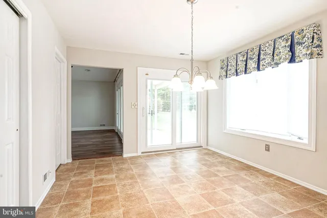 a view of an empty room and window