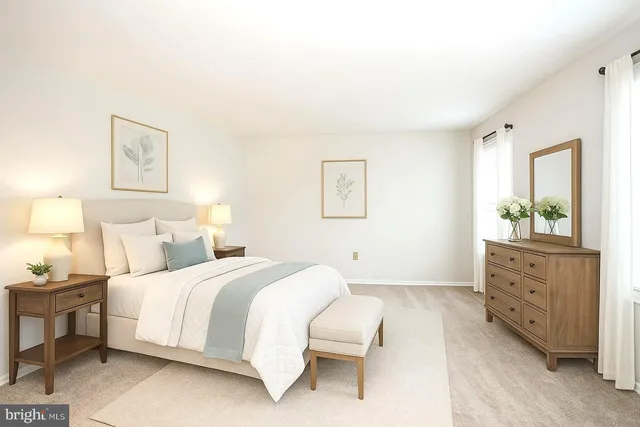 a bedroom with a bed and a dresser