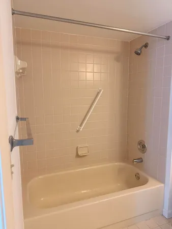 a bathroom with a sink toilet and mirror