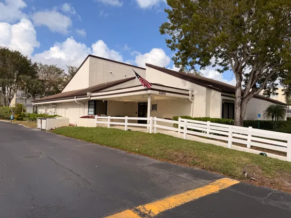a view of a swimming pool with outdoor seating