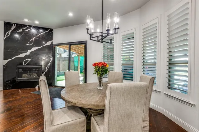 a dining room with furniture and window