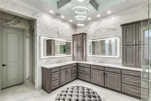 a kitchen with a sink and chandelier