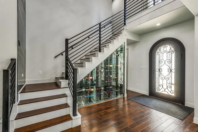 a view of entryway and hall with wooden floor