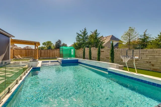 a view of yard with swimming pool and sitting area