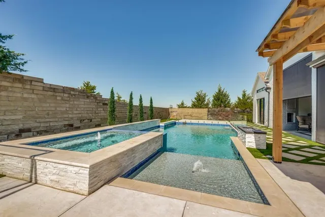 a view of swimming pool with a patio