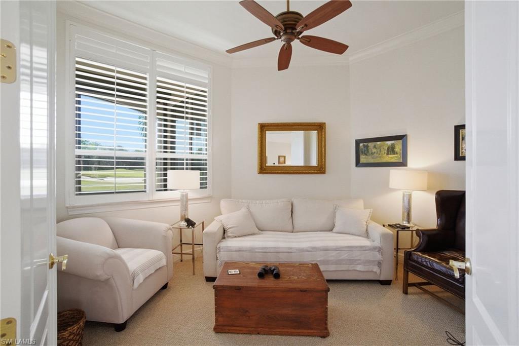 17015 Porta Vecchio Way, Unit 101 Naples, FL 34110 - Photo 20 of 39 a living room with furniture and a window