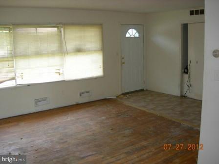 6005 Johnnycake Road Catonsville, MD 21228 - Photo 1 of 10 an empty room with a window