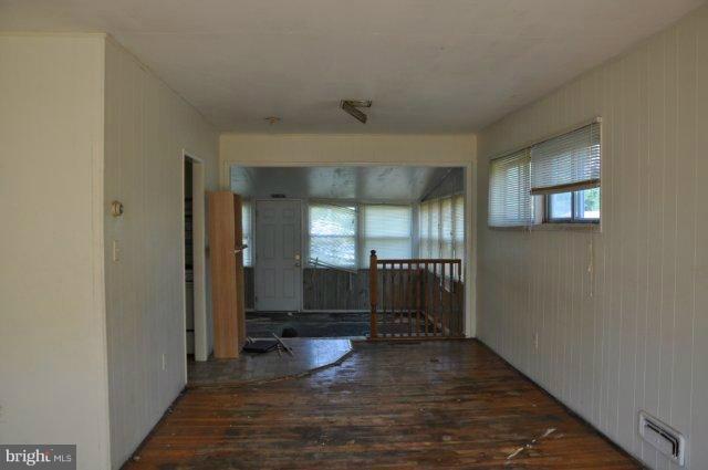 6005 Johnnycake Road Catonsville, MD 21228 - Photo 9 of 10 a view of a hallway with wooden floor and cabinet