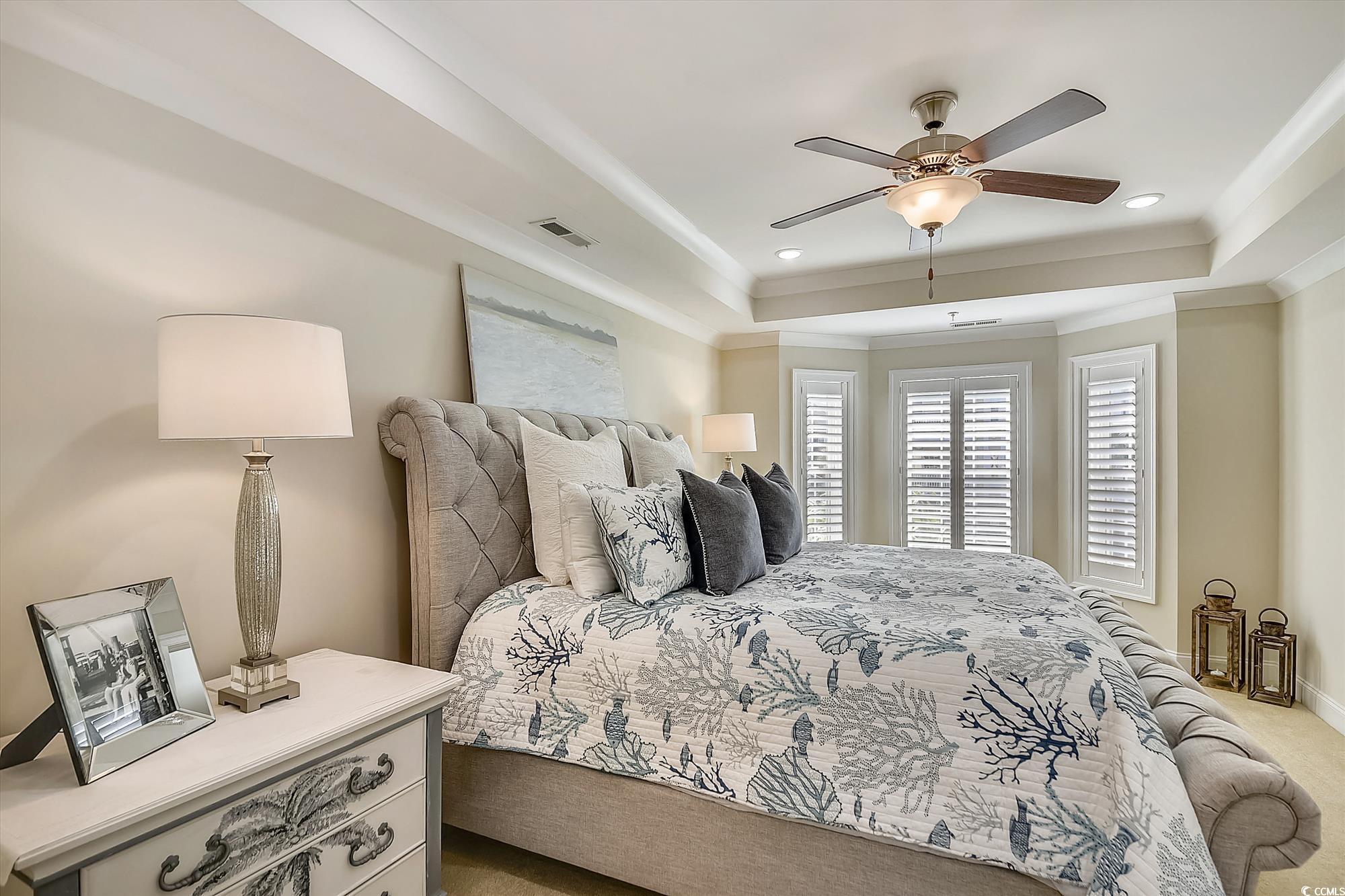 1029 Ray Costin Way, Unit VILLA 906 Murrells Inlet, SC 29576 - Photo 28 of 40 Bedroom with a raised ceiling, light colored carpet, crown molding, a ceiling fan, and recessed lighting