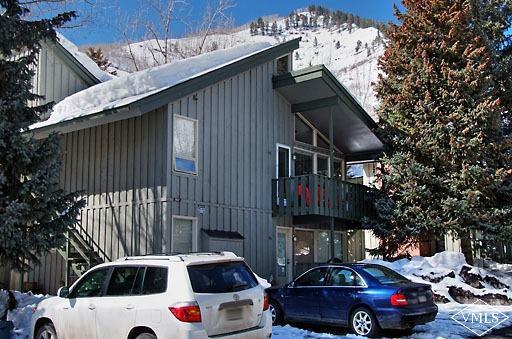 907 Red Sandstone Road, Unit 9C Vail, CO 81657 - Photo 6 of 7 a car parked in front of a house